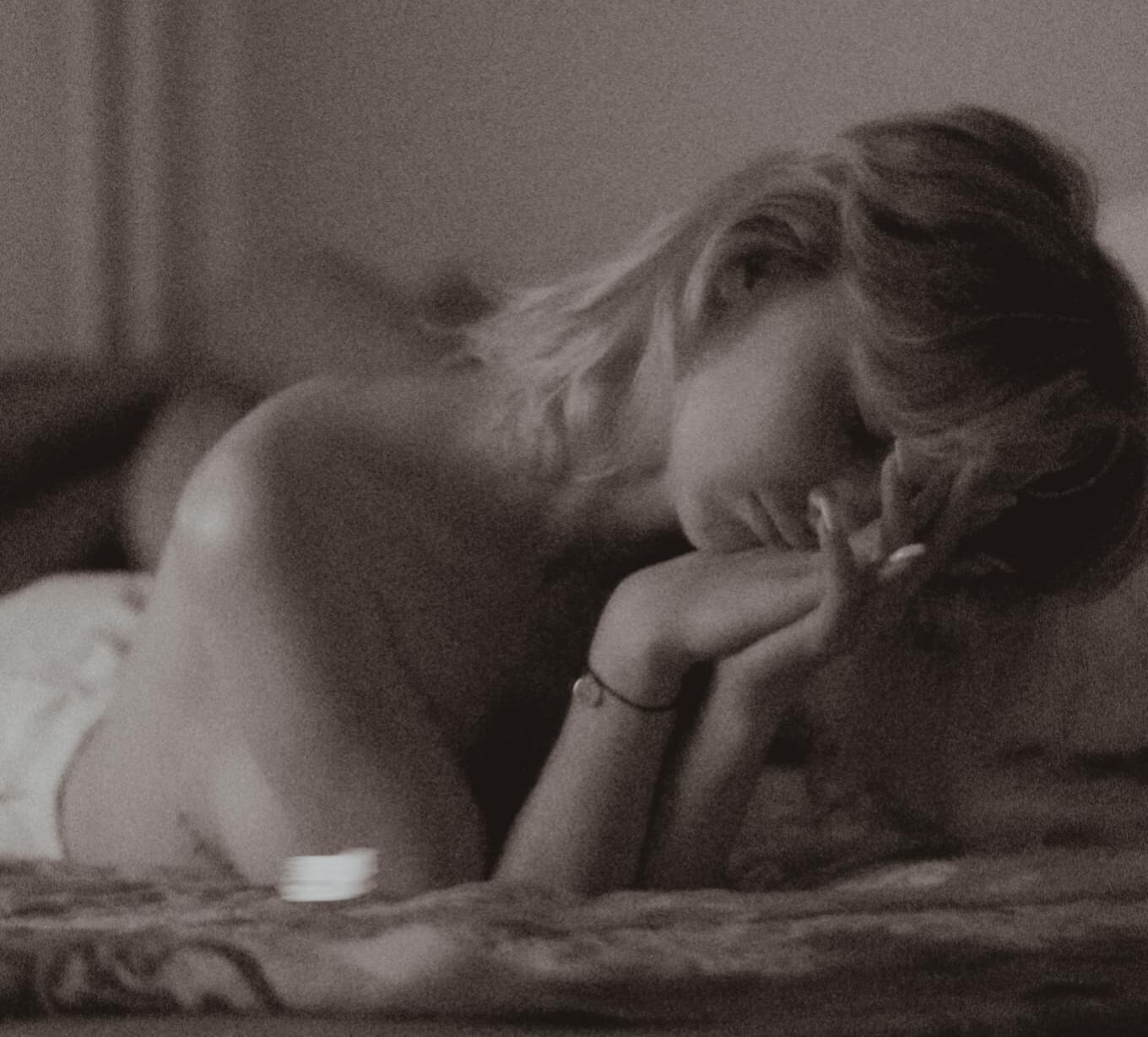 Women in bed sighing about the frustration of waking up with chest creases.